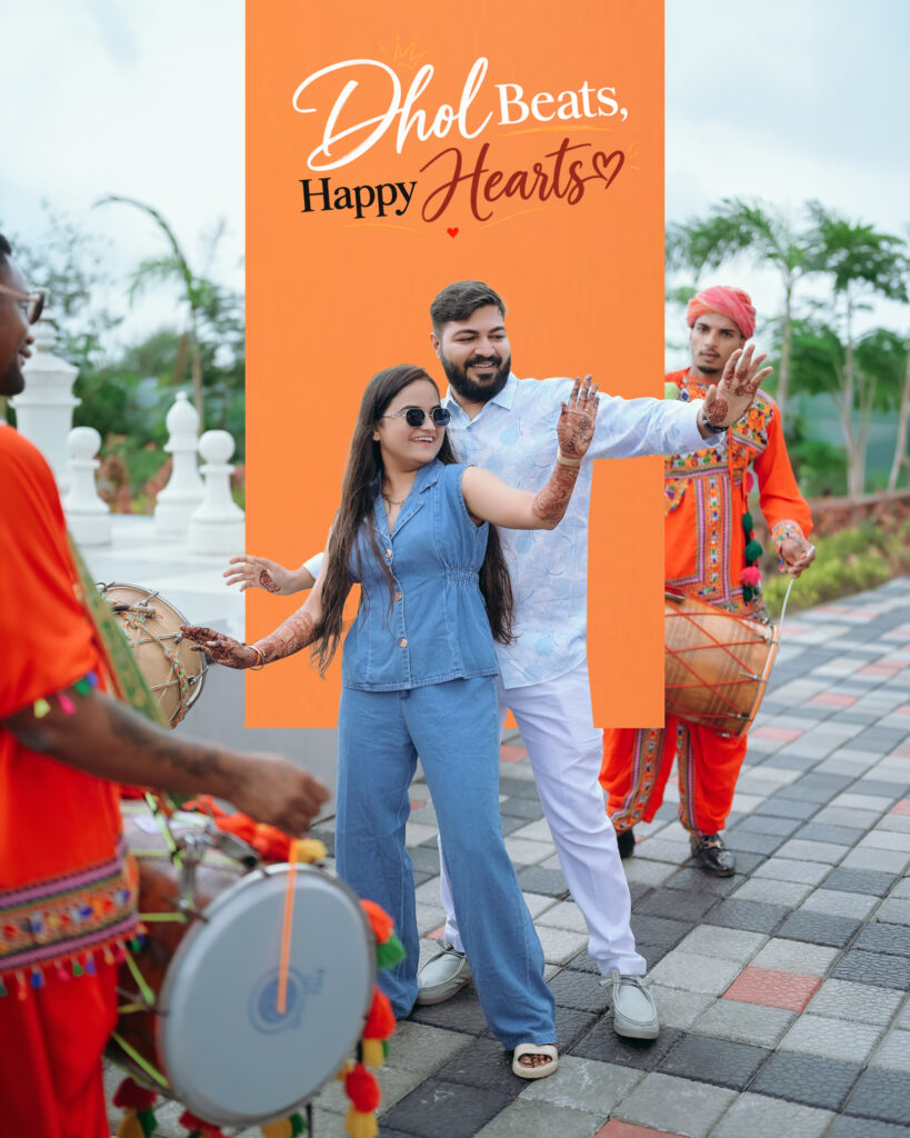 Candid wedding photography at Chitra’s City Side Resort, Solapur: couple dancing joyfully beside dhol players