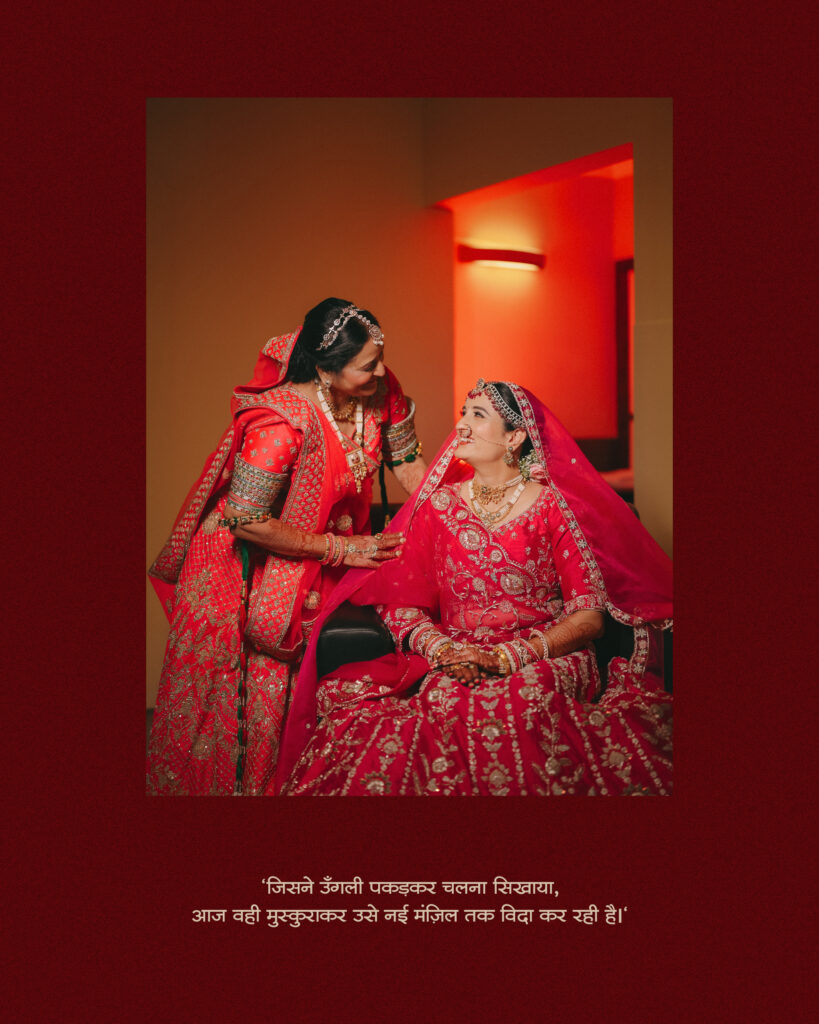 Bride smiling up at her mother in a red lehenga during an emotional bridal portrait session in Lonavala