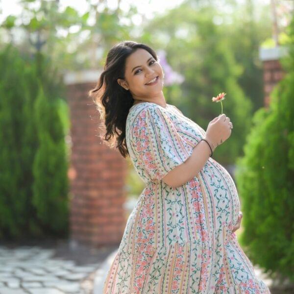 Indoor maternity photoshoot in Solapur with elegant studio lighting