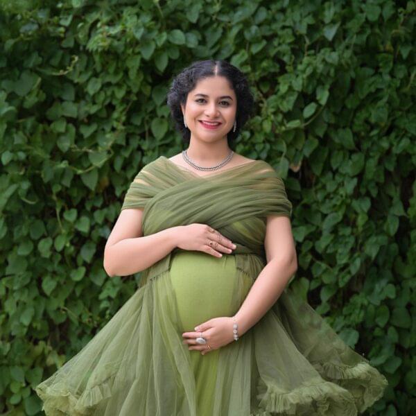 Indoor maternity photoshoot in Solapur with elegant studio lighting